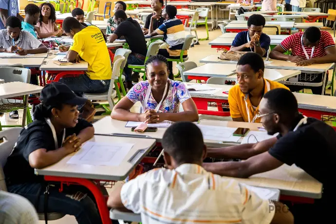 A classroom with students working together in groups, symbolizing collaboration, teamwork, and interactive learning.
